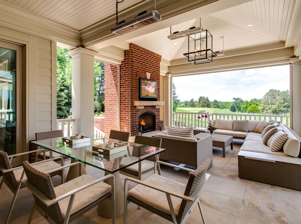 Classic veranda in Denver with a fire feature and a roof extension.