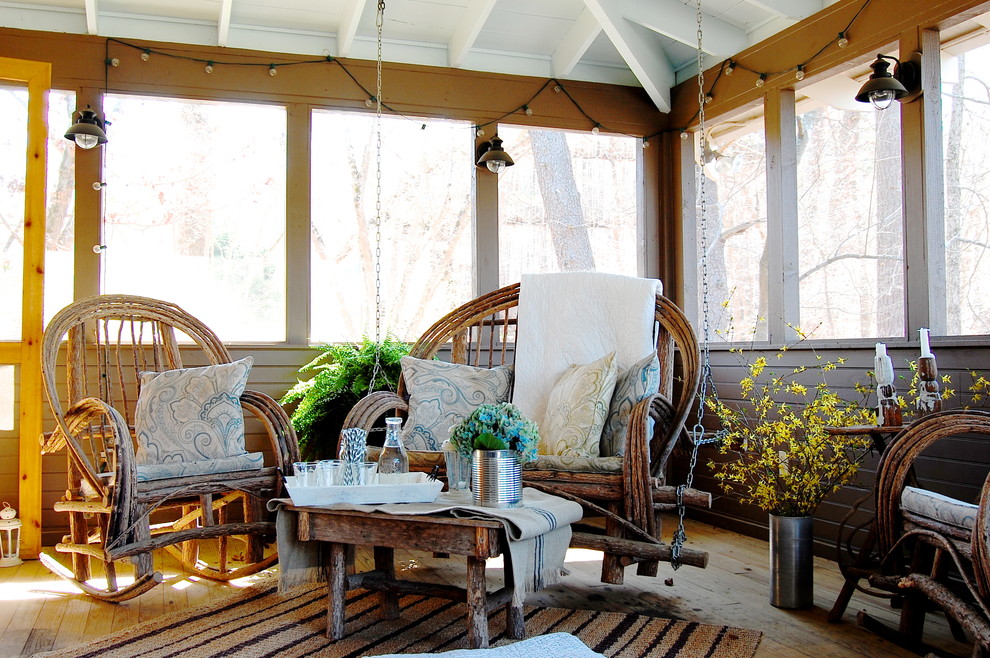 Rustic veranda in New York with feature lighting.