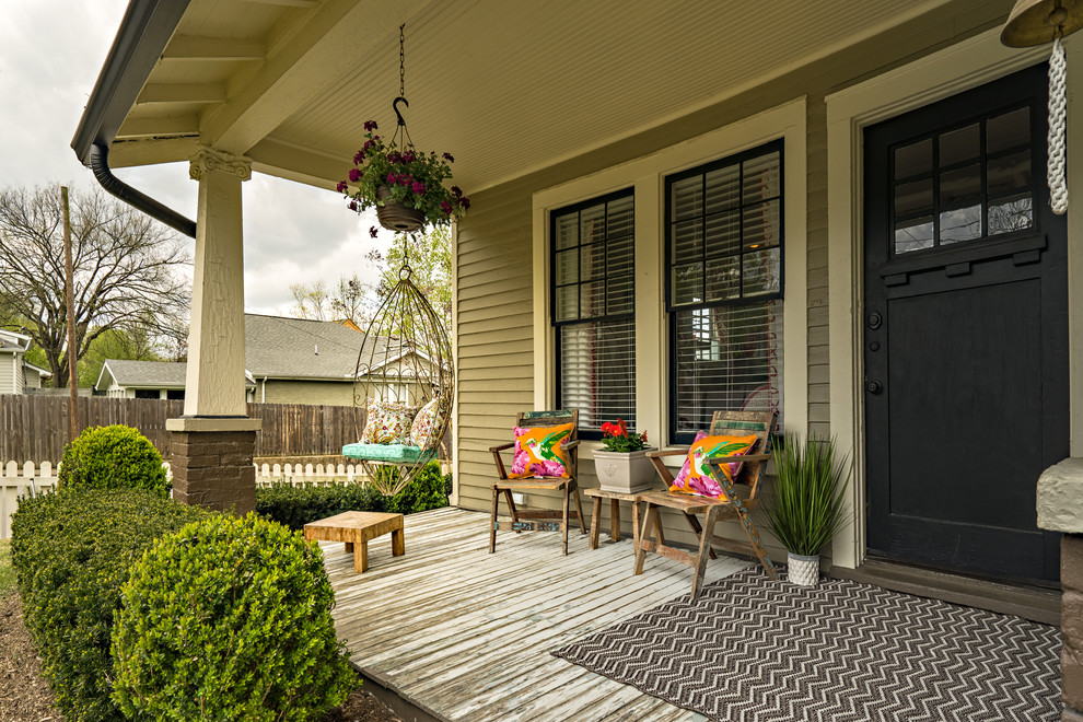 Inspiration for a mid-sized eclectic porch remodel in Nashville with decking and a roof extension