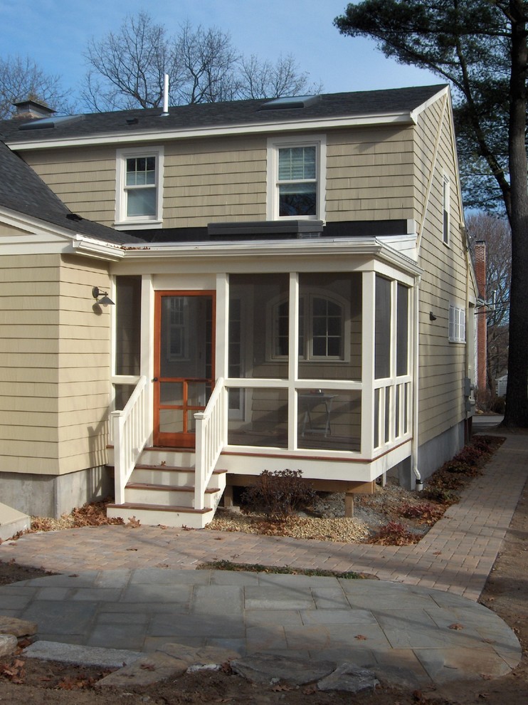 Design ideas for a small traditional back screened veranda in Boston with a roof extension.