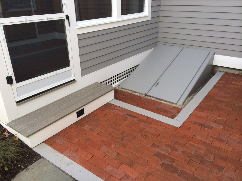 Idee per un piccolo portico minimal dietro casa con pavimentazioni in mattoni
