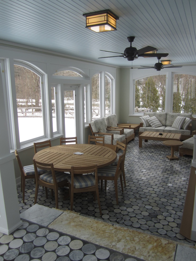 Huge classic tile screened-in back porch idea in New York with a roof extension