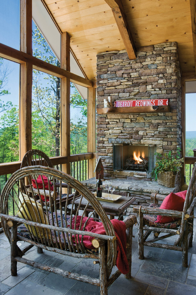 Inspiration for a rustic side veranda in Other with a roof extension.