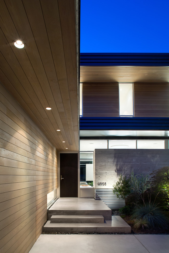 Idée de décoration pour un porche d'entrée de maison minimaliste.