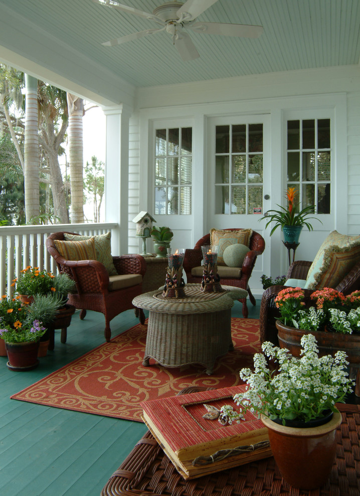 Eclectic porch photo in Orlando with decking and a roof extension