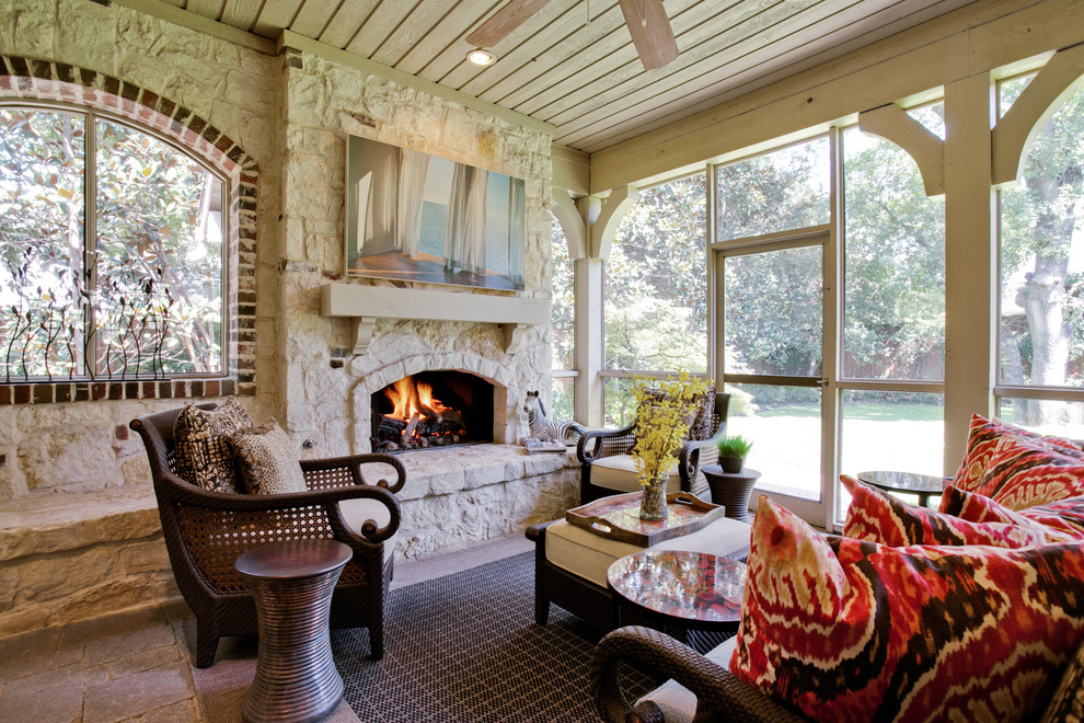 Elegant porch photo in Dallas with a fire pit and a roof extension