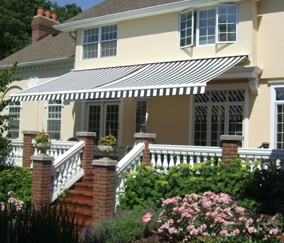 Front veranda in Other with brick paving and an awning.