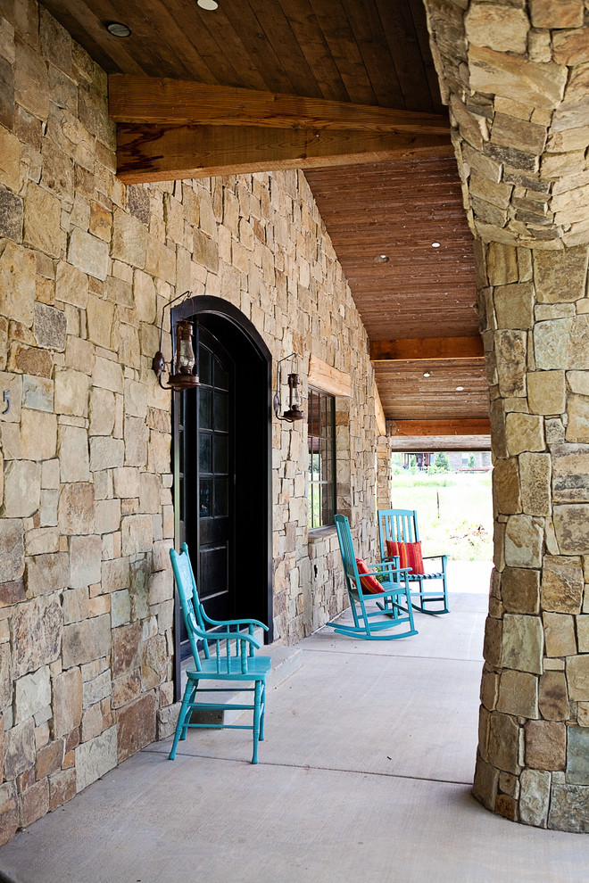 Mountain style porch photo in Salt Lake City with a roof extension