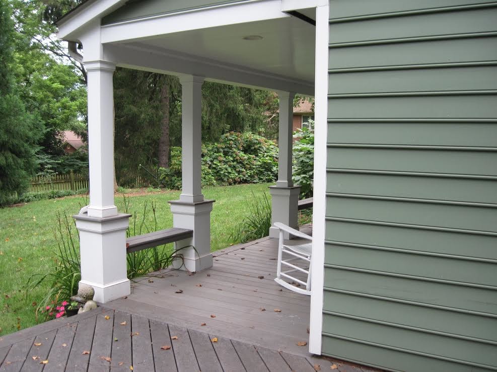 Mid-sized classic back porch idea in Richmond with decking and a roof extension