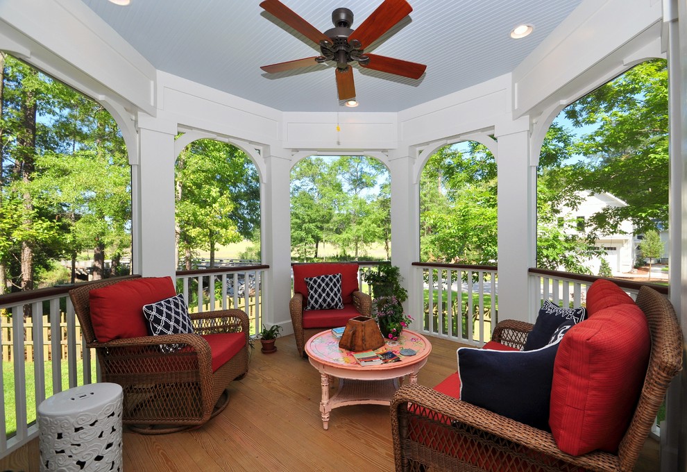 Classic screened-in back porch idea in Charleston with decking and a roof extension