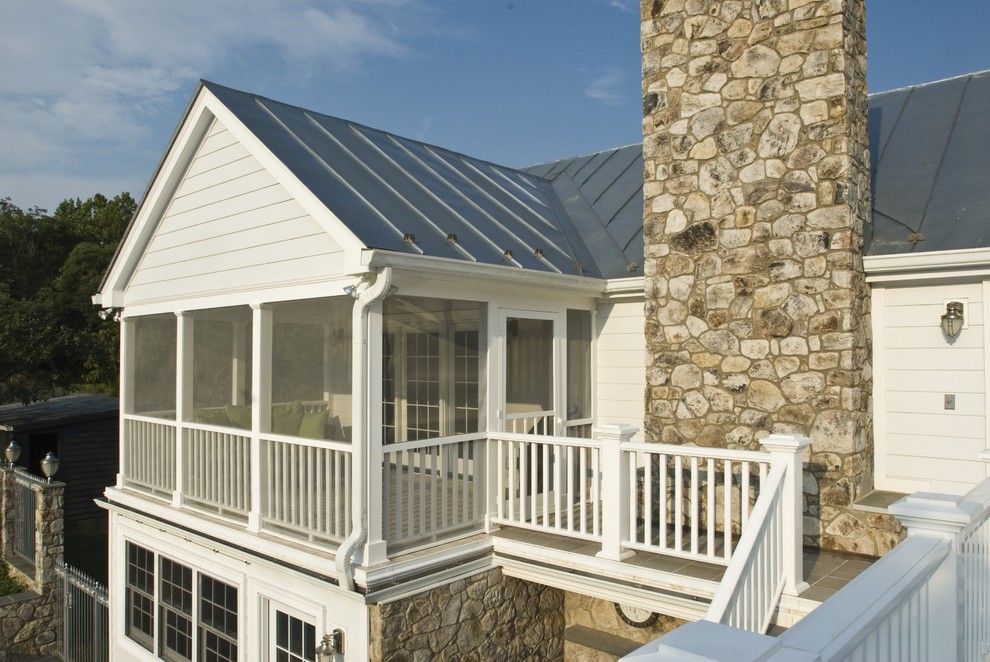 Réalisation d'un porche d'entrée de maison champêtre avec une extension de toiture.