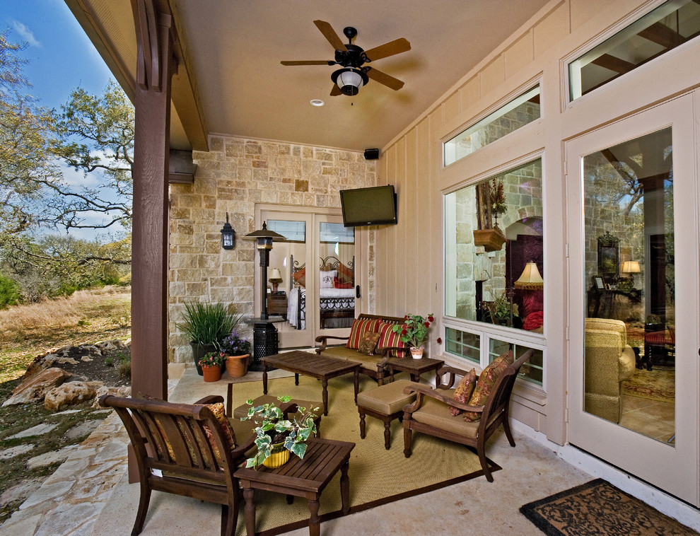 Photo of a traditional veranda in Austin with a roof extension.