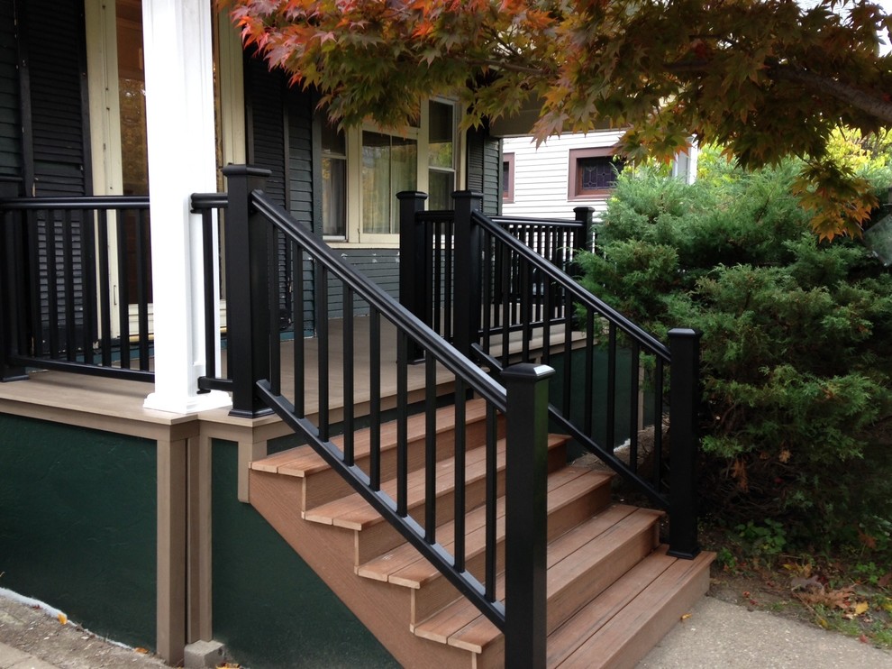 Inspiration for a mid-sized timeless front porch remodel in Other with a roof extension