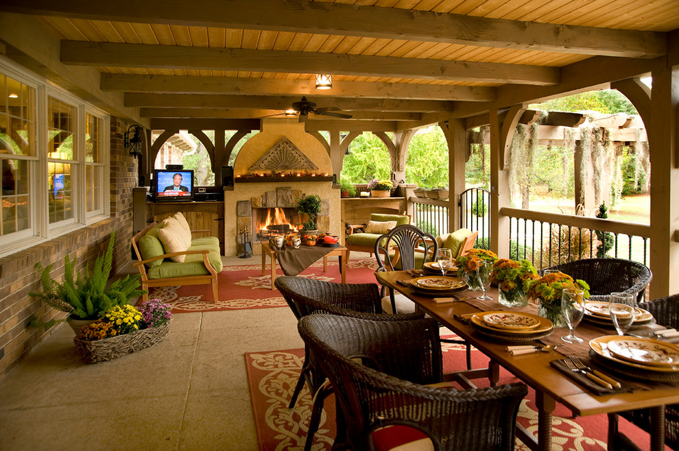Photo of a traditional veranda in Other with a fire feature.