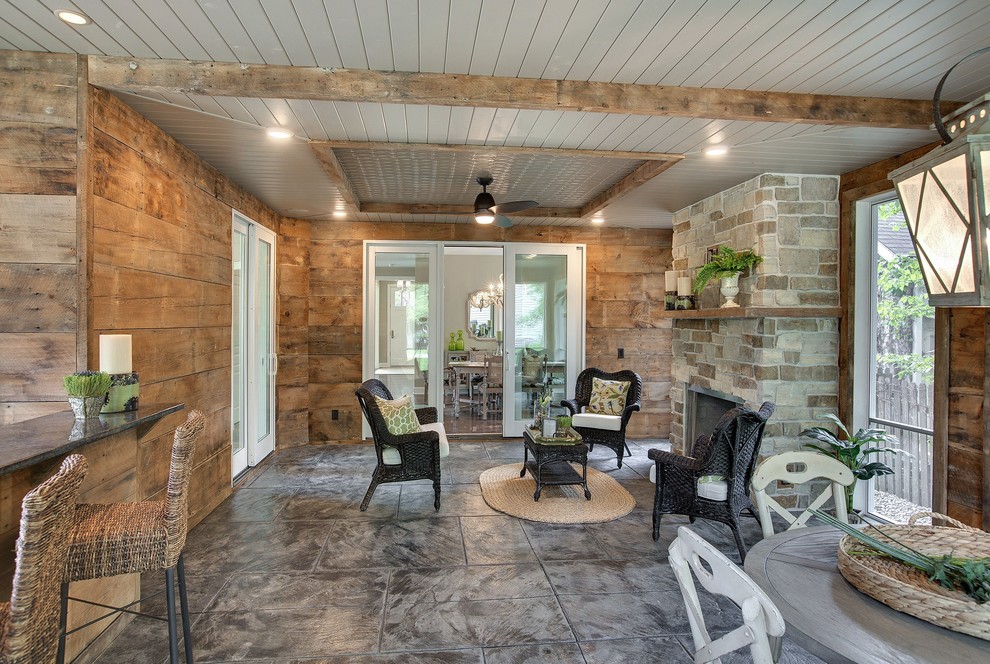 Large classic stamped concrete screened-in back porch idea in Minneapolis with a roof extension