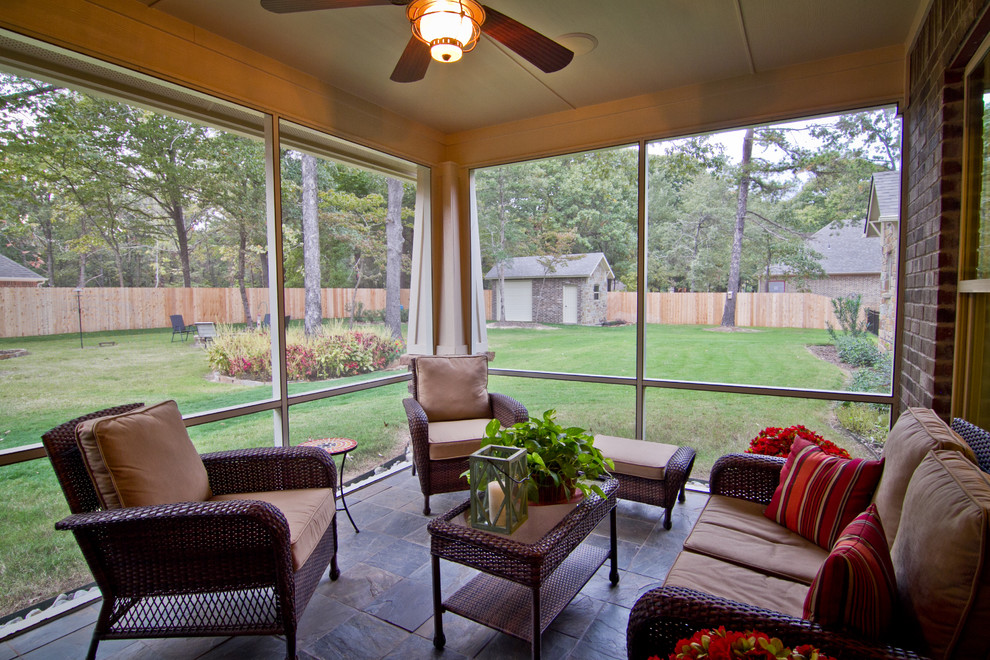 Inspiration for a mid-sized timeless tile back porch remodel in Austin with a roof extension