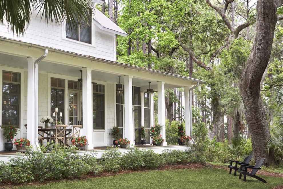 Large classic porch idea in Charleston with a roof extension