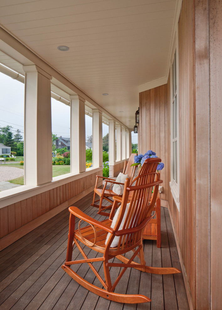 Inspiration for a large coastal front porch remodel in Boston with decking and a roof extension