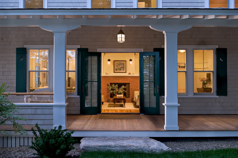 Beach style porch photo in Portland Maine with decking and a roof extension