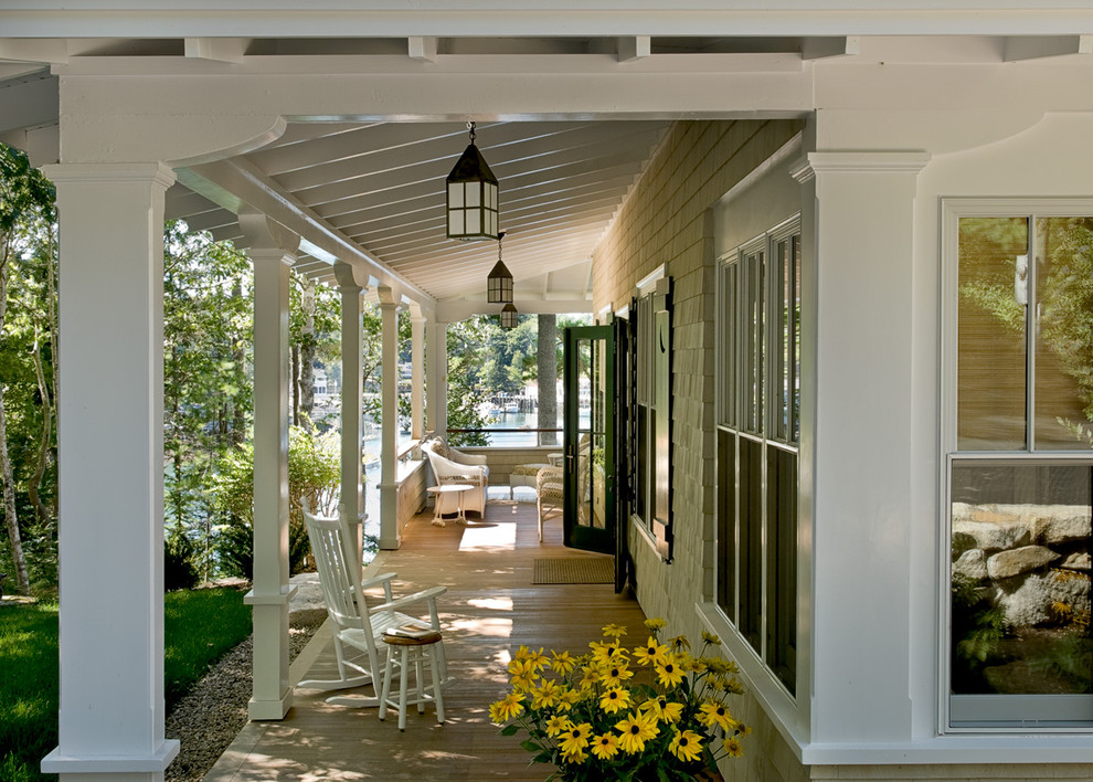 Beach style porch idea in Portland Maine with decking and a roof extension