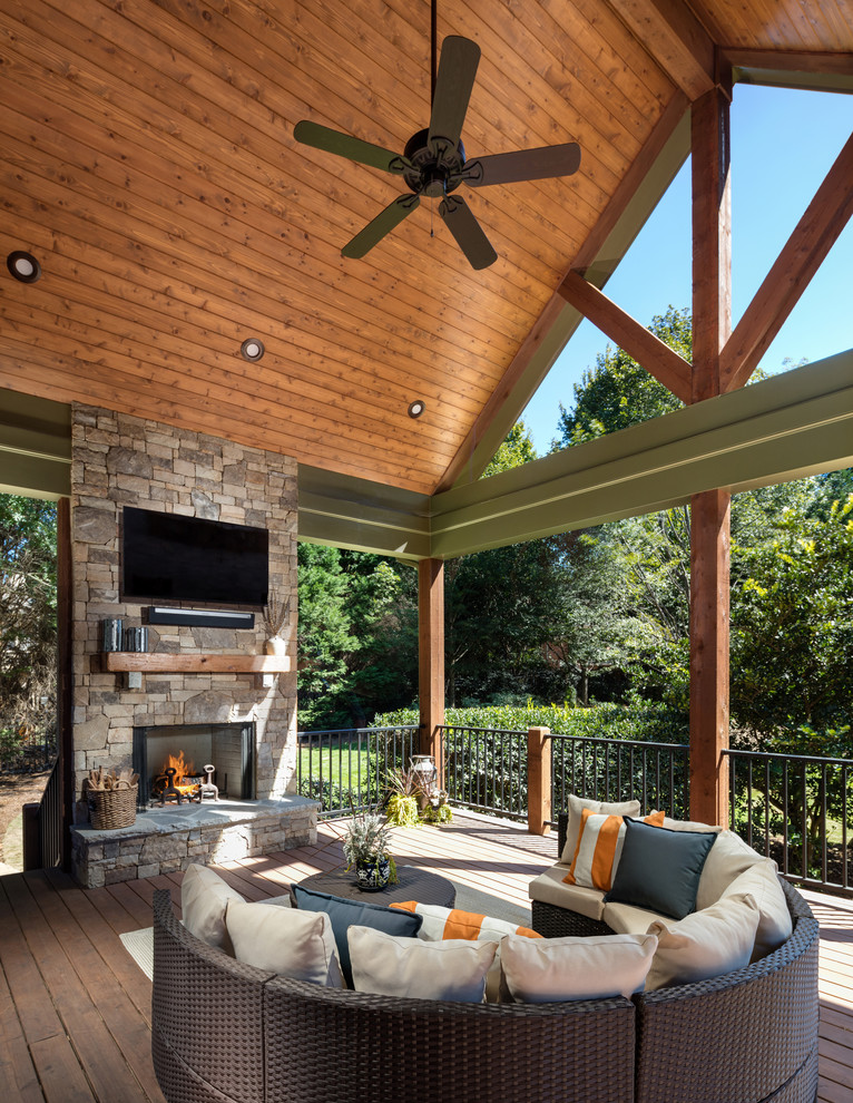 Photo of a large traditional back screened veranda in Atlanta with a roof extension.