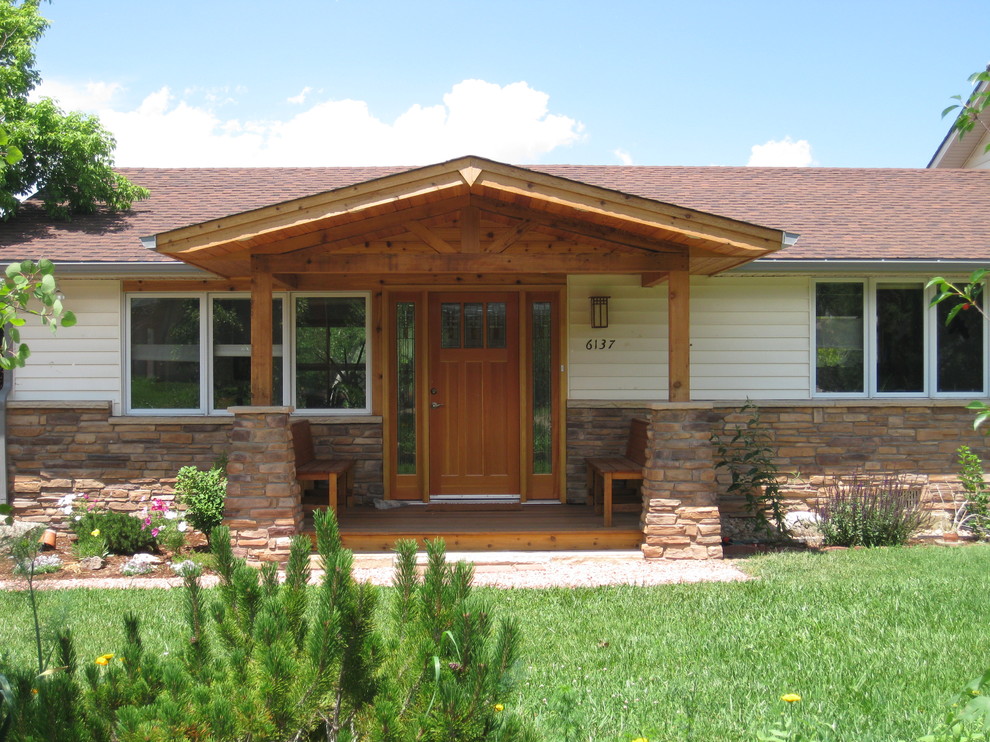 Mid-sized arts and crafts front porch idea in Denver with decking and a roof extension