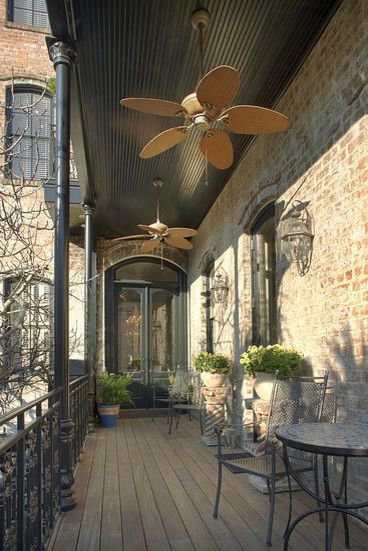 This is an example of a large victorian side porch design in Atlanta.
