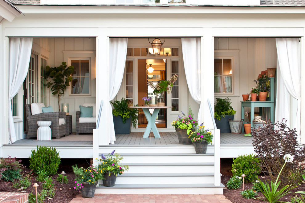 Inspiration for a medium sized traditional front veranda in Atlanta with decking, a potted garden and a roof extension.