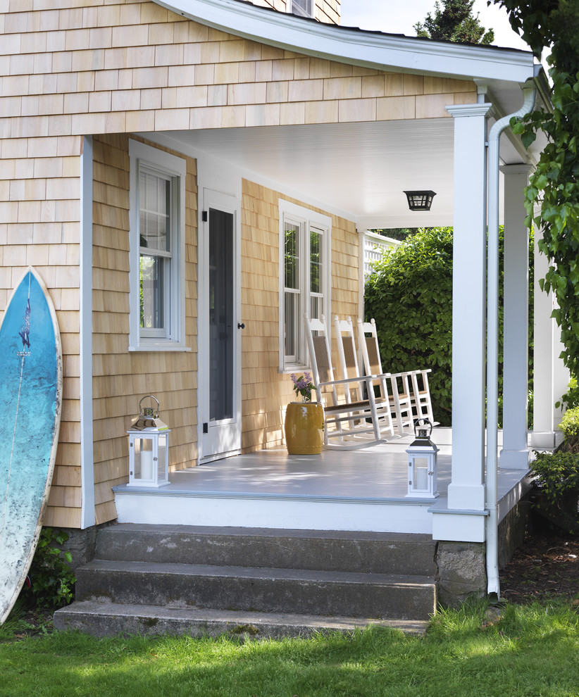 Beach style porch idea in Providence with decking and a roof extension