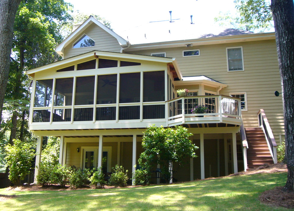 Medium sized traditional back veranda in Atlanta with a roof extension.
