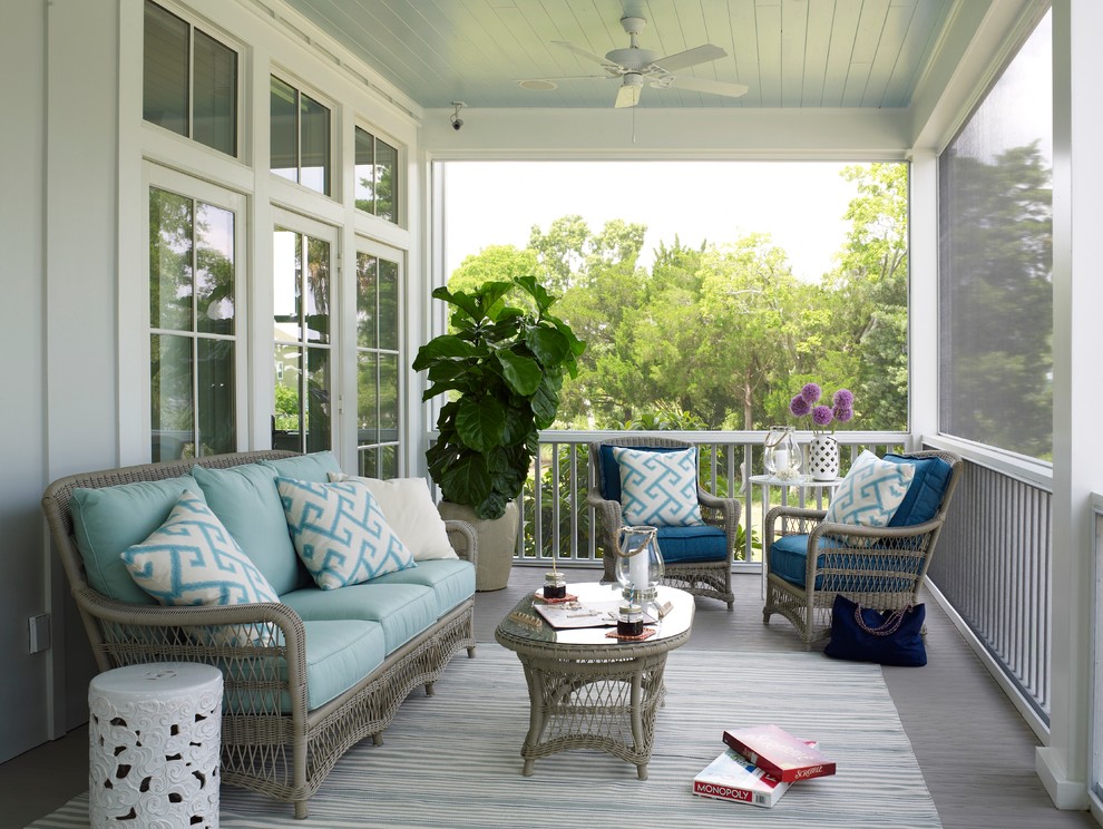 Inspiration for a coastal screened-in porch remodel in Charleston with decking and a roof extension