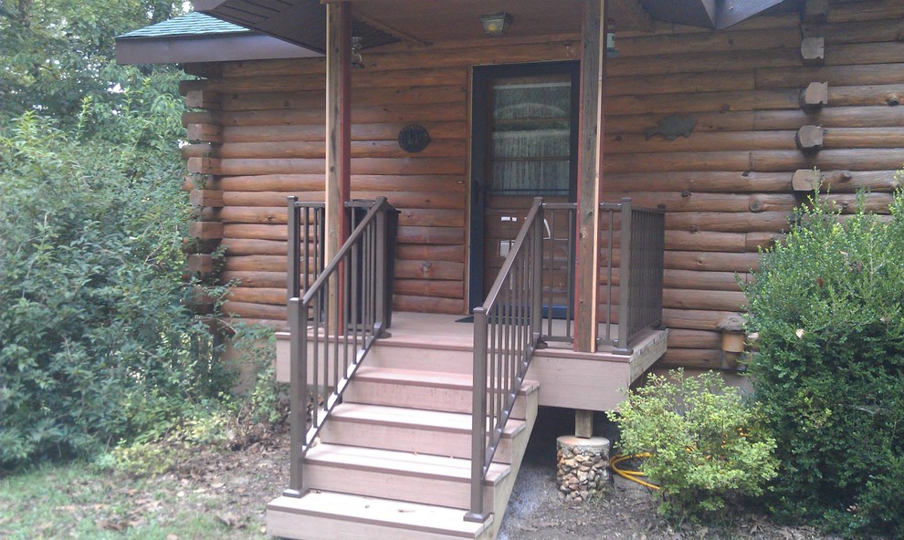 Inspiration for a small front porch remodel in Other with decking and a roof extension
