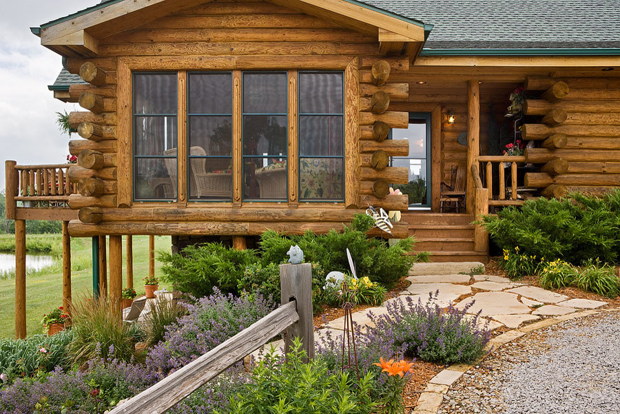 This is an example of a rustic porch design in Milwaukee.