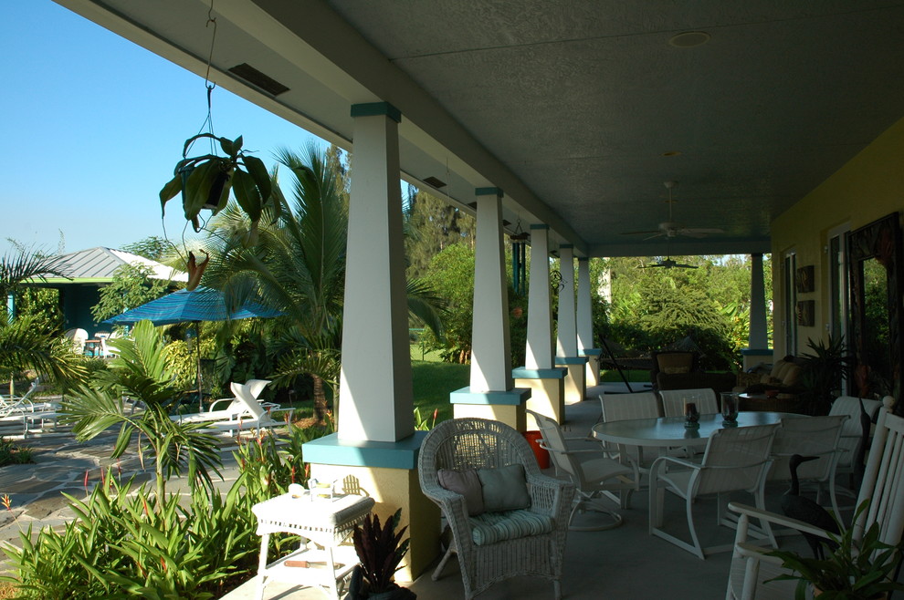 This is an example of a tropical porch design in Miami.