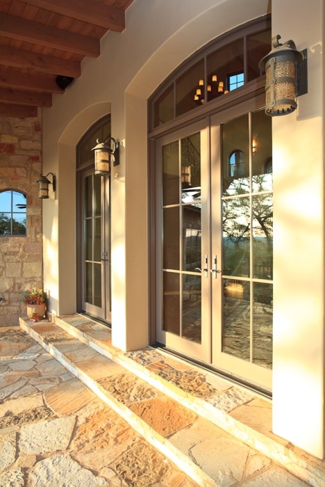 This is an example of a mediterranean porch design in Austin.