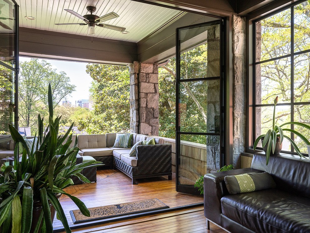 Design ideas for a large classic front veranda in Atlanta with decking and a roof extension.
