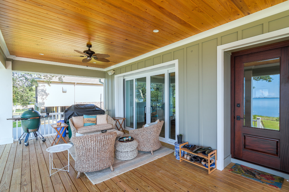 Photo of a medium sized beach style back veranda in Atlanta with decking and a roof extension.
