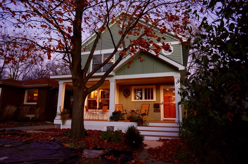 Inspiration for a medium sized eclectic front veranda in Minneapolis with a roof extension.