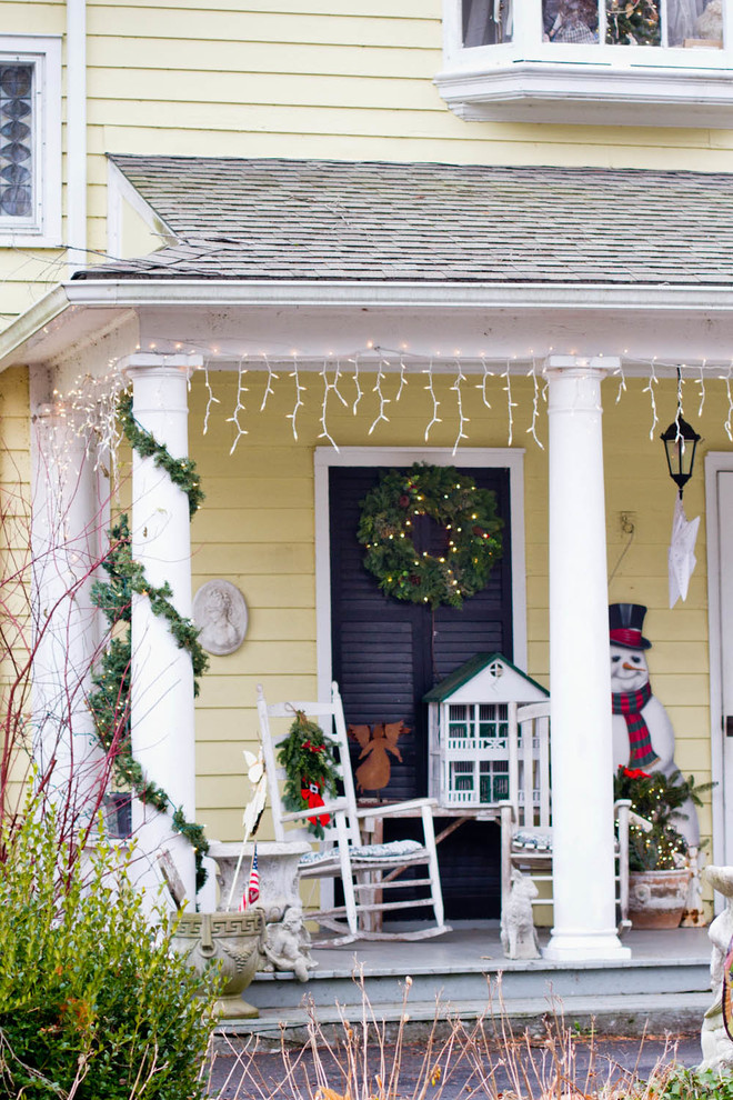 This is an example of a traditional porch design in New York with a roof extension.