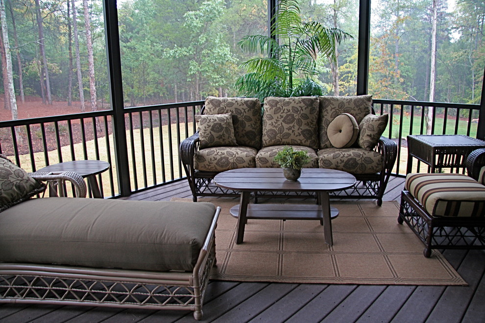 Mid-sized elegant screened-in back porch photo in Other with decking and a roof extension
