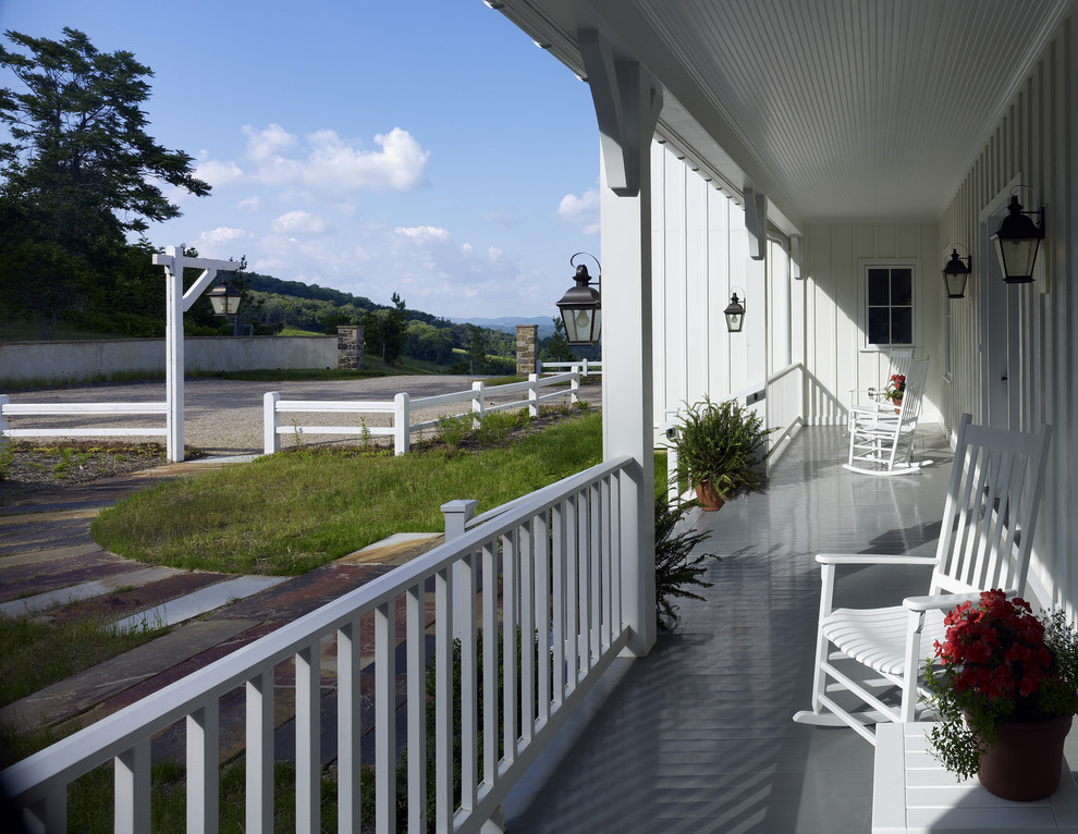 Cottage porch idea in DC Metro with decking and a roof extension