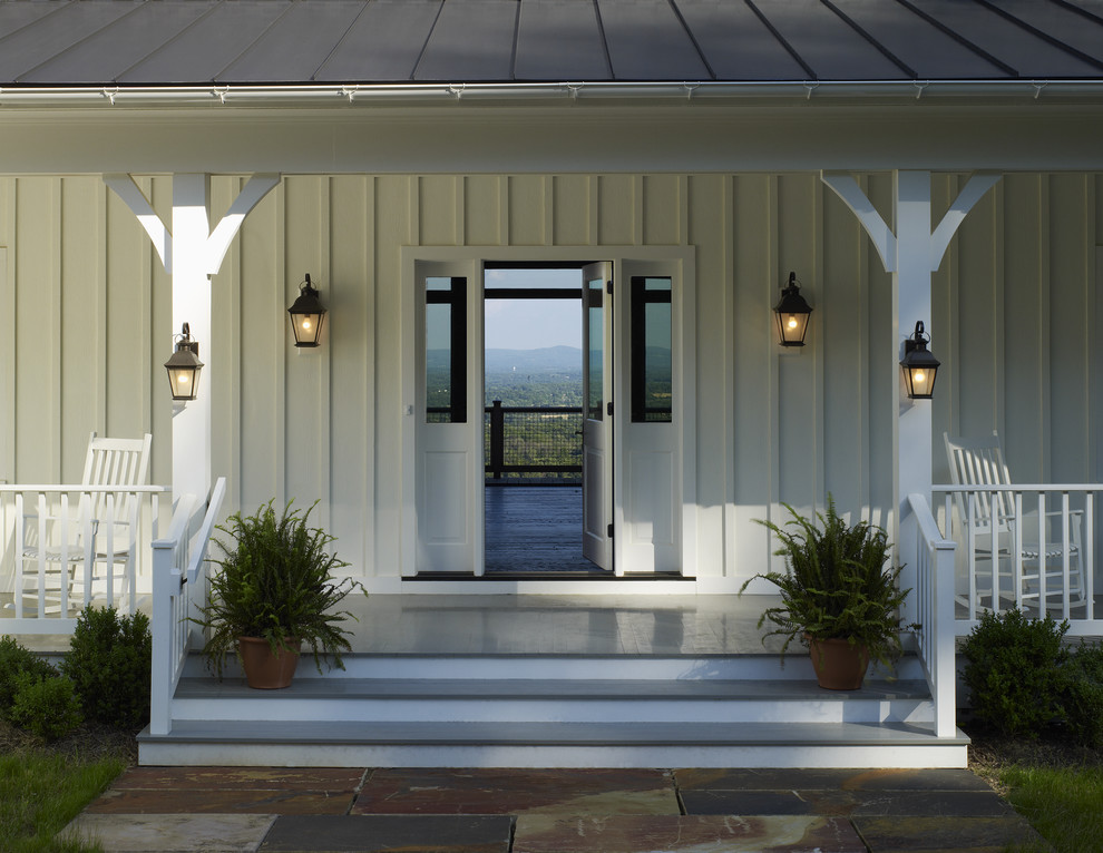 Farmhouse porch photo in DC Metro with a roof extension
