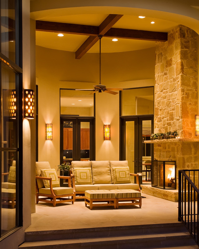 Design ideas for a contemporary back veranda in Austin with a fire feature.