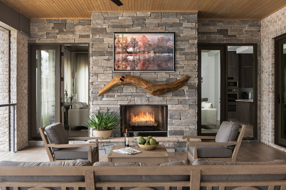 Inspiration for a rustic veranda in Other with a fire feature and a roof extension.