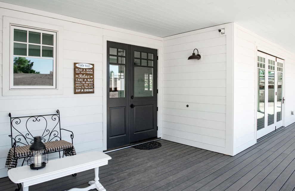 Inspiration for a large cottage front porch remodel in Los Angeles with a roof extension