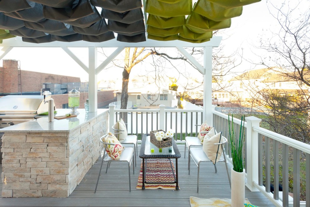 This is an example of a traditional back veranda in New York with a fire feature and decking.
