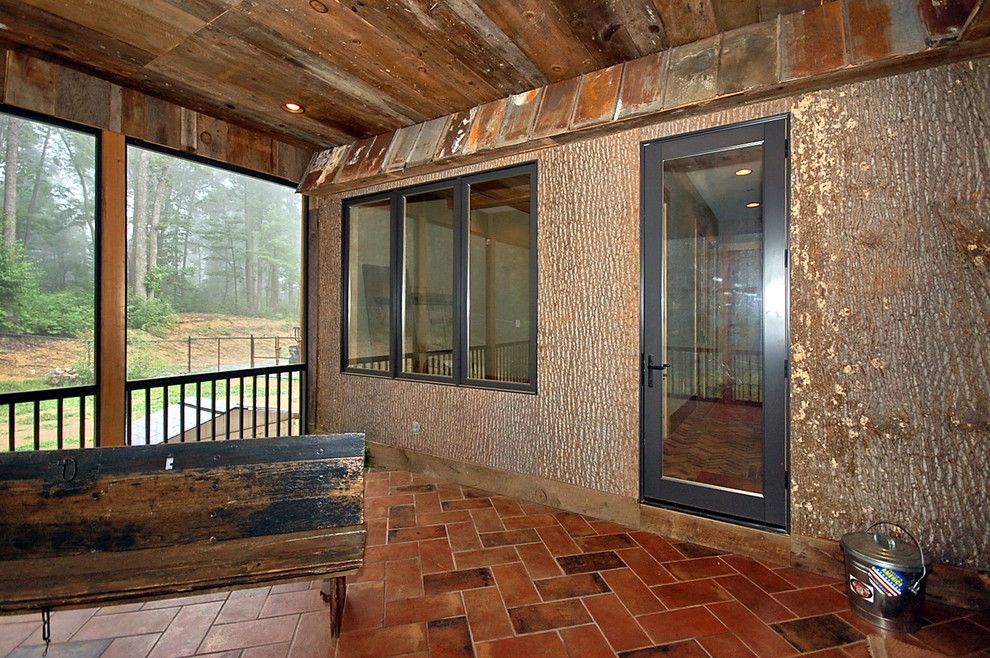 Large mountain style tile screened-in back porch photo in Other with a roof extension