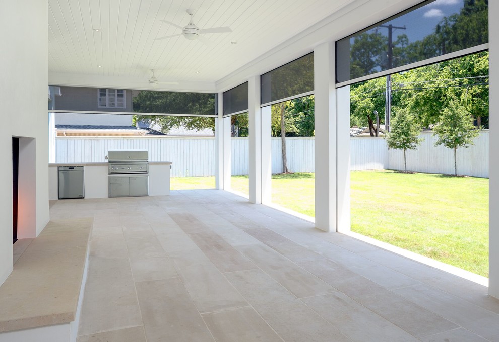 Inspiration for a large modern back screened veranda in Dallas with concrete paving and a roof extension.