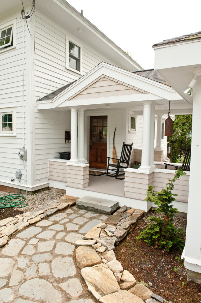 This is an example of a traditional porch design in Portland Maine with a roof extension.