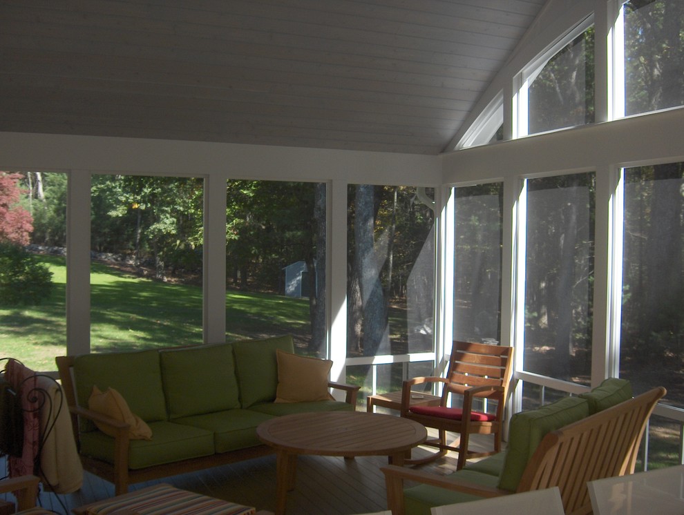 Large bohemian back screened veranda in Boston with decking and a roof extension.
